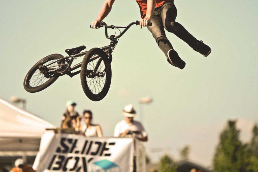 person doing stunts on bike