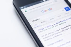 A Google search page for the word “analytics” on a mobile phone